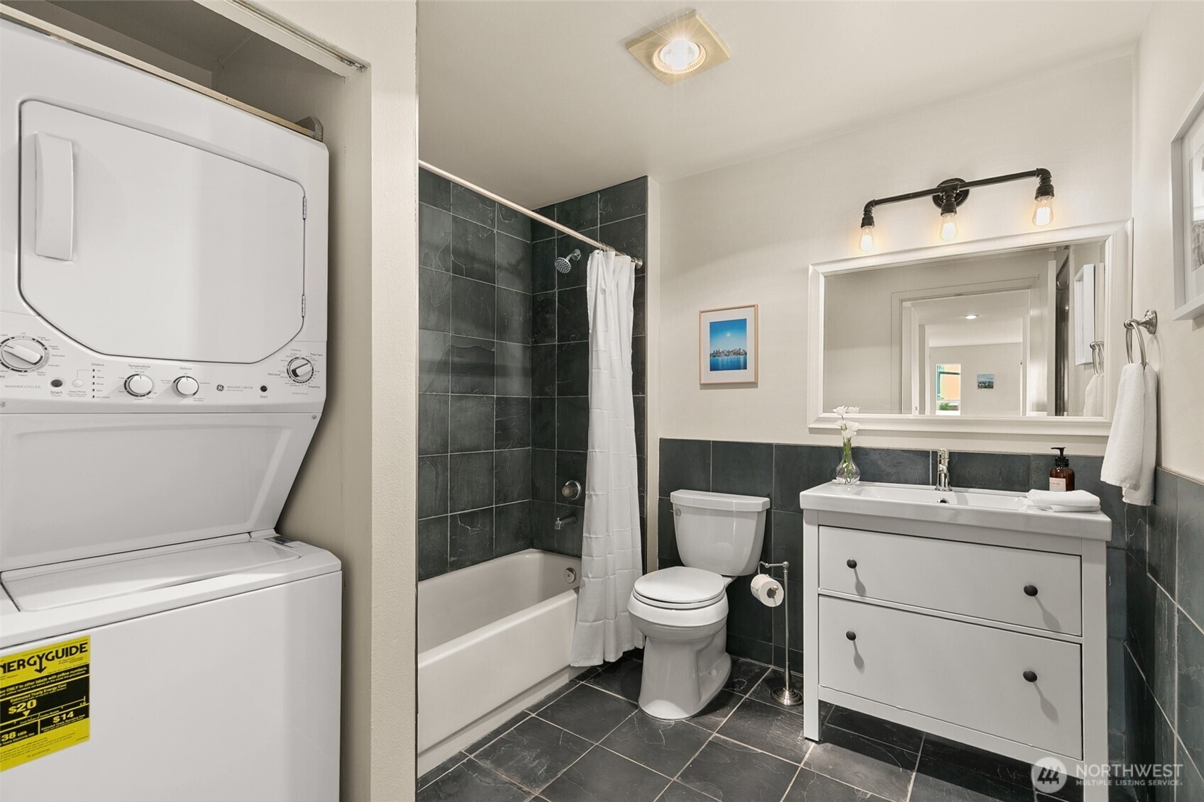 500 Aloha Street, Unit 202 Seattle, WA 98109 - Photo 12 of 15 a bathroom with a sink toilet and shower