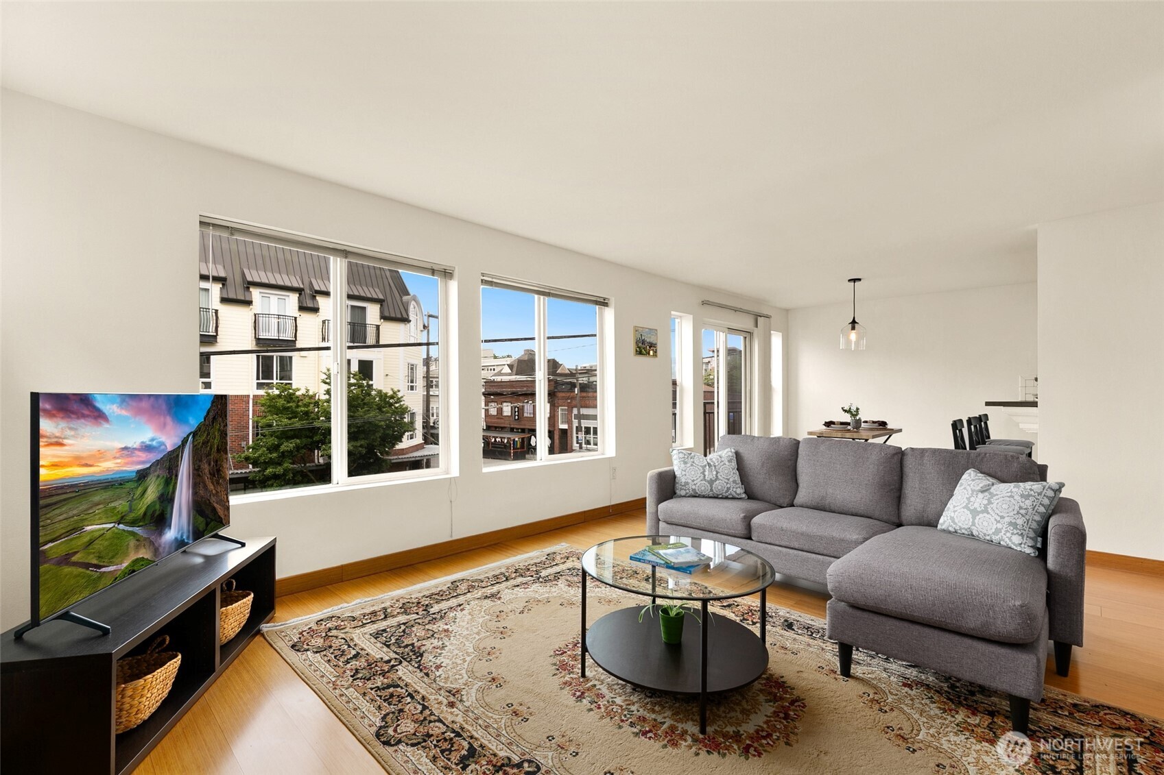 500 Aloha Street, Unit 202 Seattle, WA 98109 - Photo 2 of 15 a living room with furniture and a flat screen tv