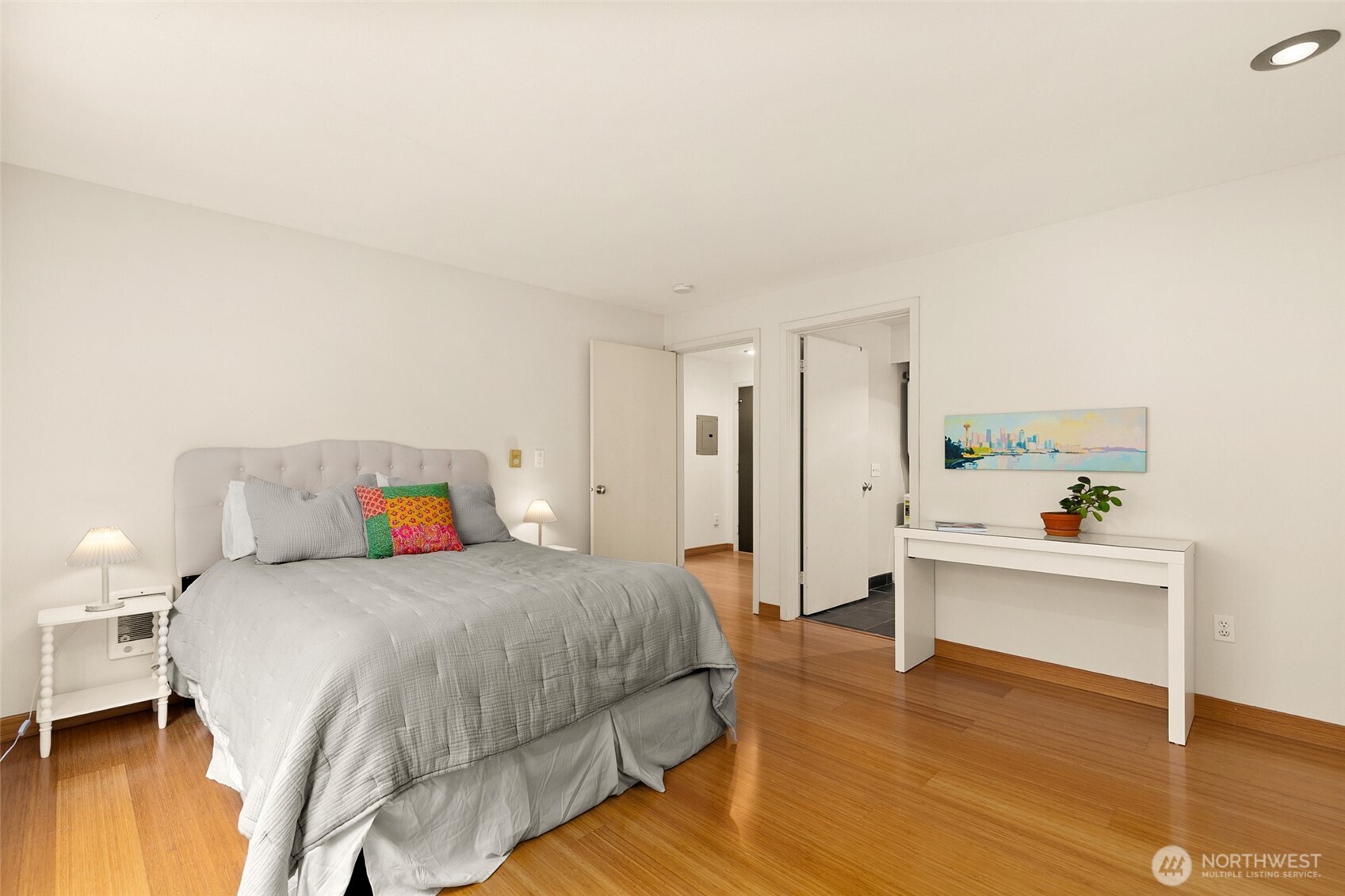 500 Aloha Street, Unit 202 Seattle, WA 98109 - Photo 9 of 15 a bedroom with a bed and a table