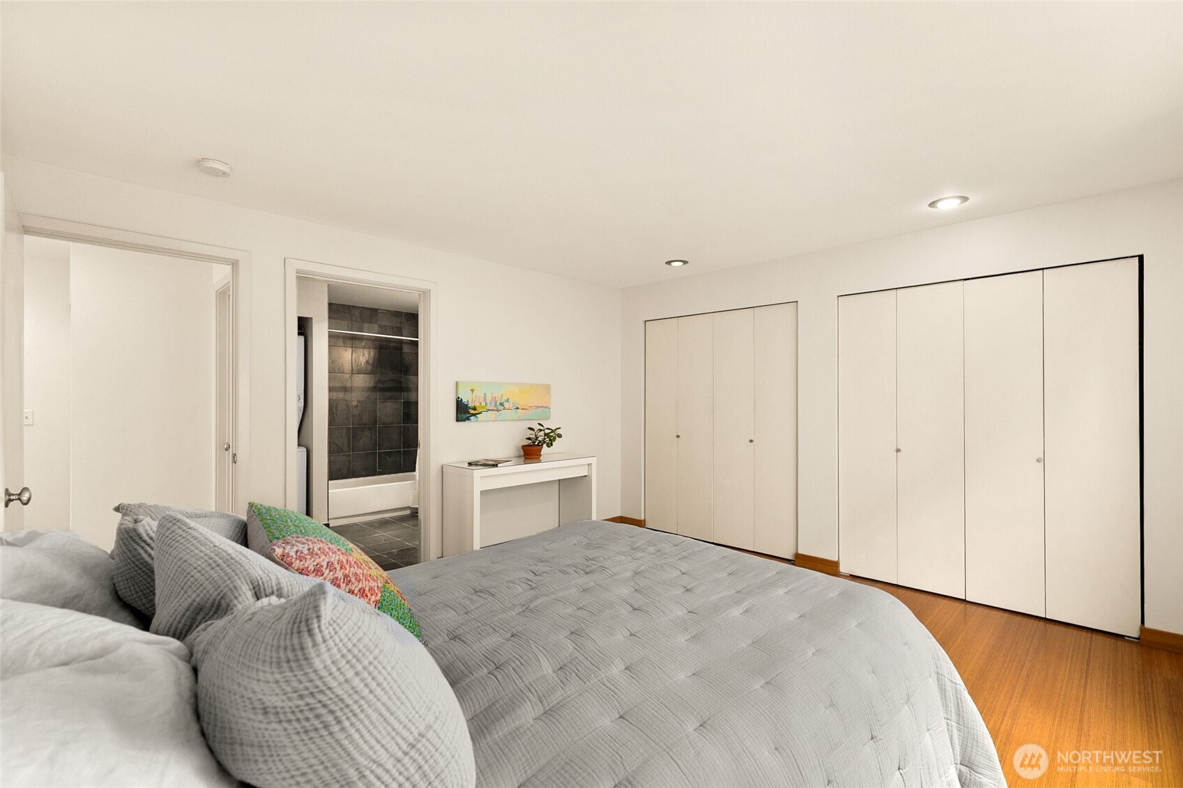 500 Aloha Street, Unit 202 Seattle, WA 98109 - Photo 10 of 15 a bedroom with a bed and a couch