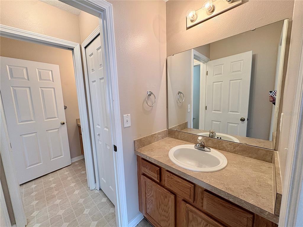 12007 Peach Avenue Seffner, FL 33584 - Photo 13 of 14 a bathroom with a sink and a mirror
