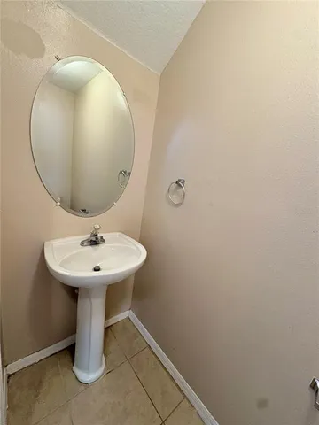 a bathroom with a sink and mirror