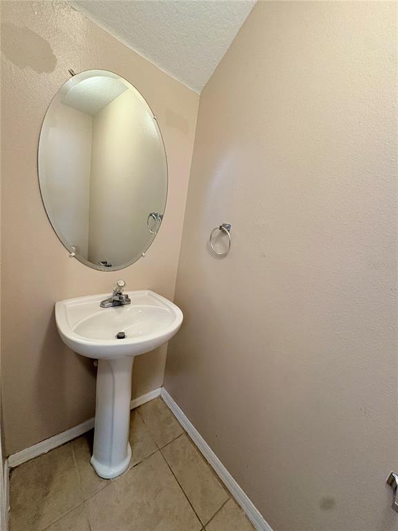 12007 Peach Avenue Seffner, FL 33584 - Photo 6 of 14 a bathroom with a sink and mirror