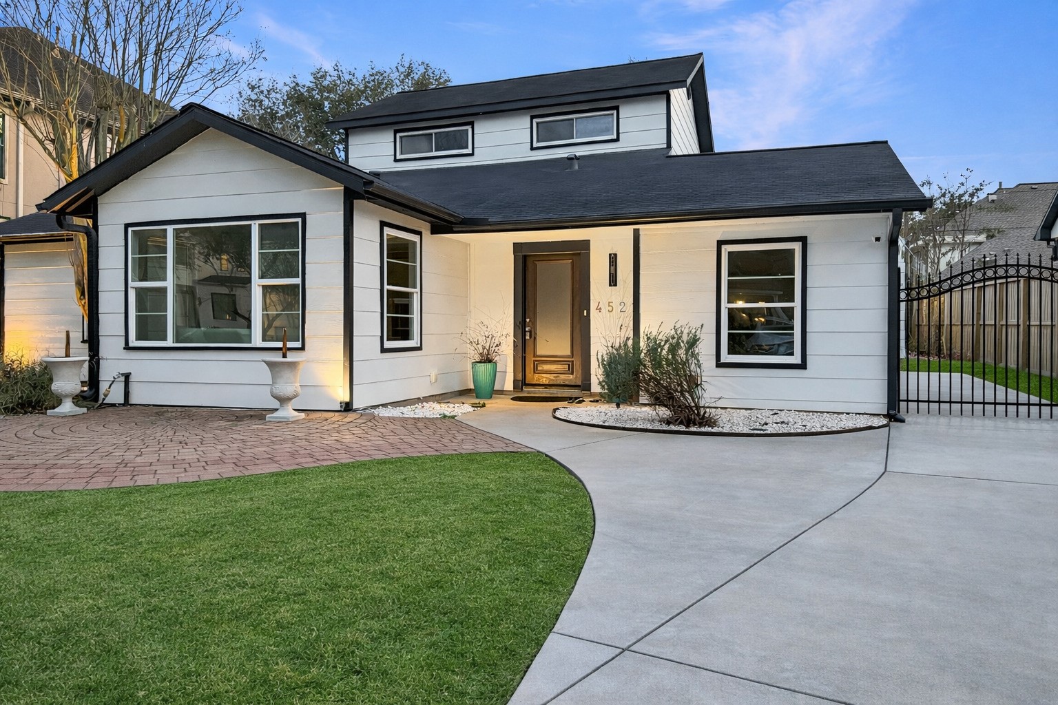 4521 Maple Street Bellaire, TX 77401 - Photo 2 of 36 Closeup of property - Expanded driveway and gated entry providing privacy and additional parking.