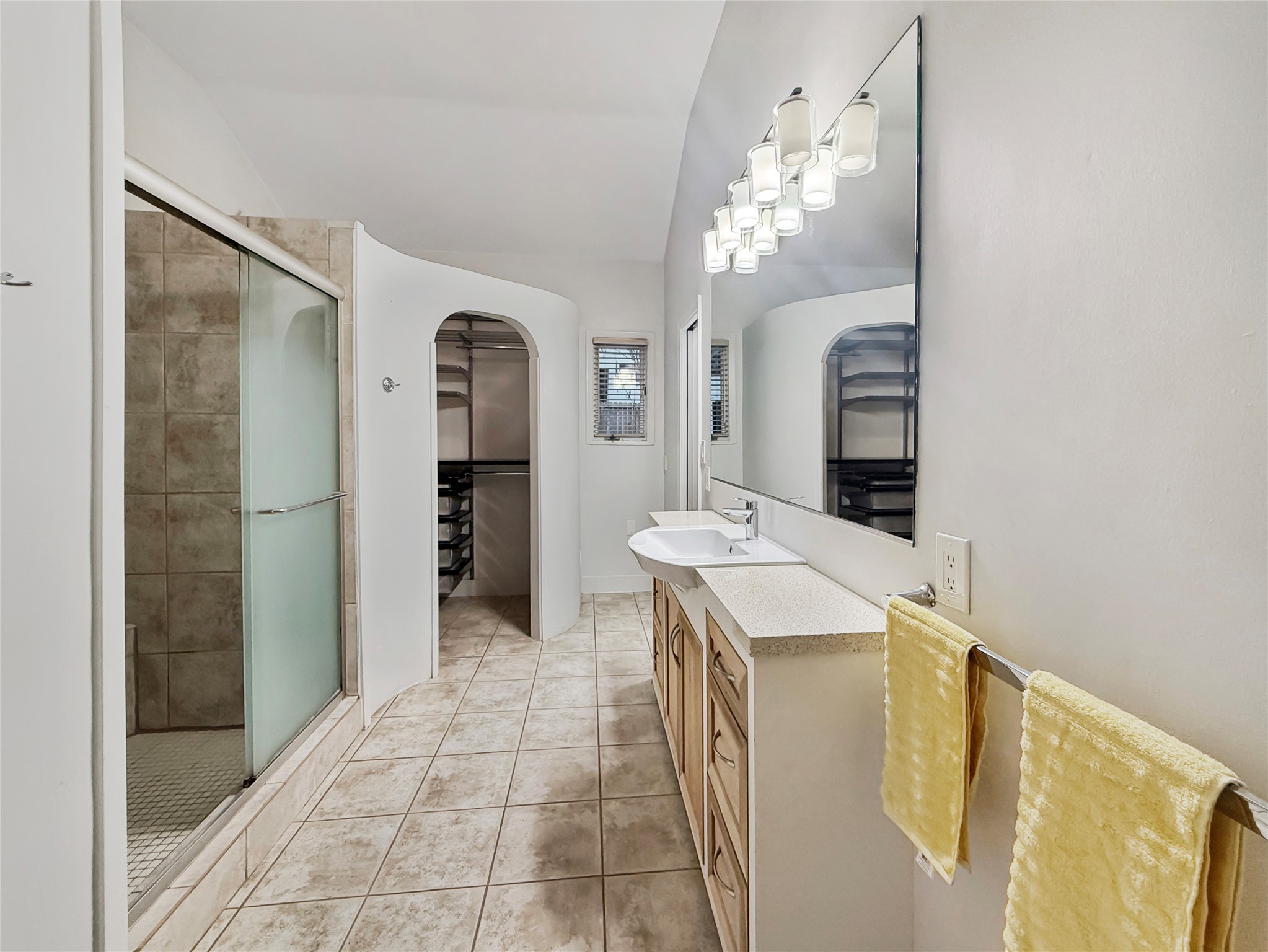 4521 Maple Street Bellaire, TX 77401 - Photo 24 of 36 Primary bathroom with walk-in shower, and his and her custom closets.