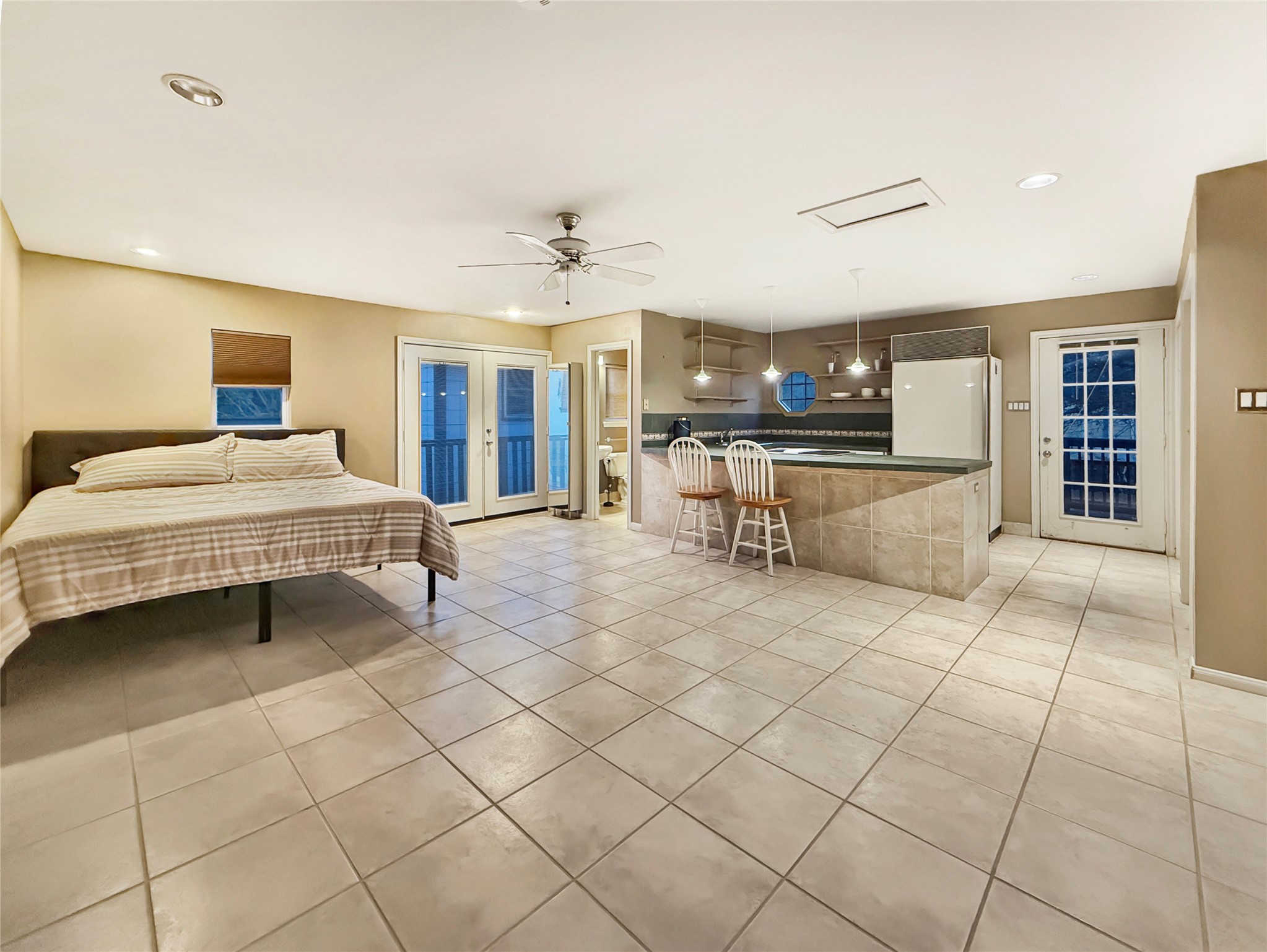 4521 Maple Street Bellaire, TX 77401 - Photo 30 of 36 Private-entry garage apartment with kitchenette, breakfast bar seating, full bathroom, closet space, and generous open living space ideal for guests, rental potential, or multigenerational living.