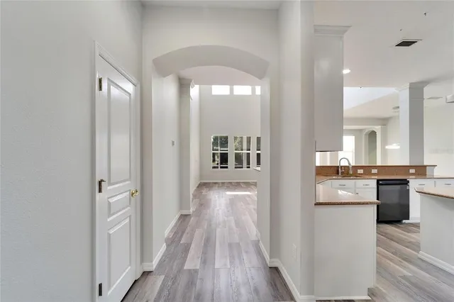 a kitchen with stainless steel appliances a refrigerator sink and stove
