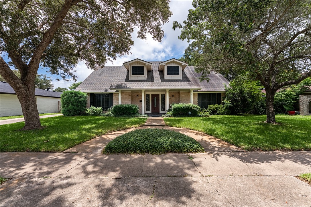 4325 St George Drive Corpus Christi, TX 78413 - Photo 1 of 22 a front view of a house with a yard