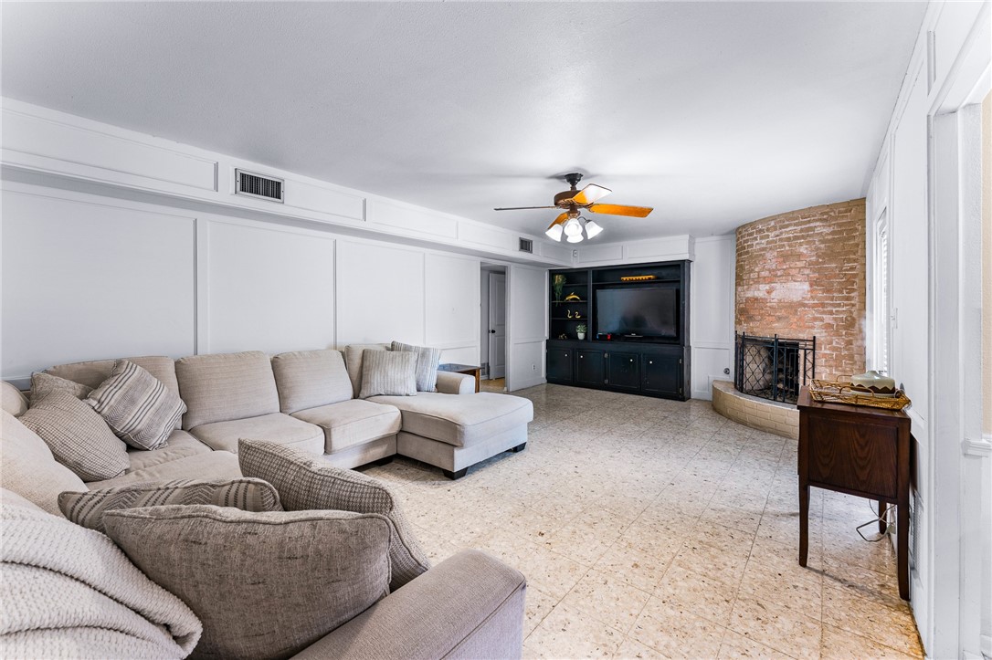 4325 St George Drive Corpus Christi, TX 78413 - Photo 12 of 22 a living room with furniture and a fireplace
