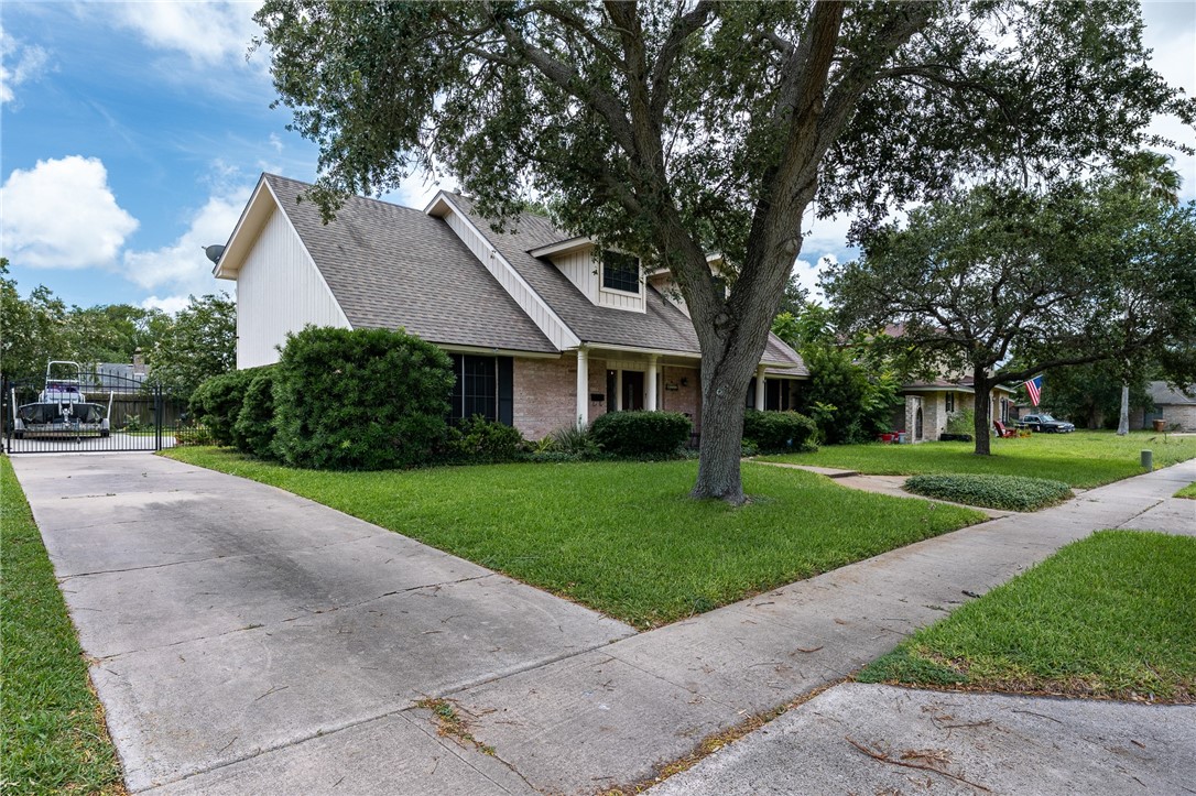 4325 St George Drive Corpus Christi, TX 78413 - Photo 2 of 22 a front view of a house with a yard