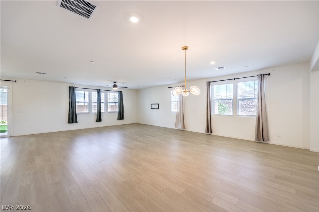 3782 Alla Rocca Avenue Henderson, NV 89044 - Photo 7 of 55 This expansive living area features luminous flooring and abundant natural light.