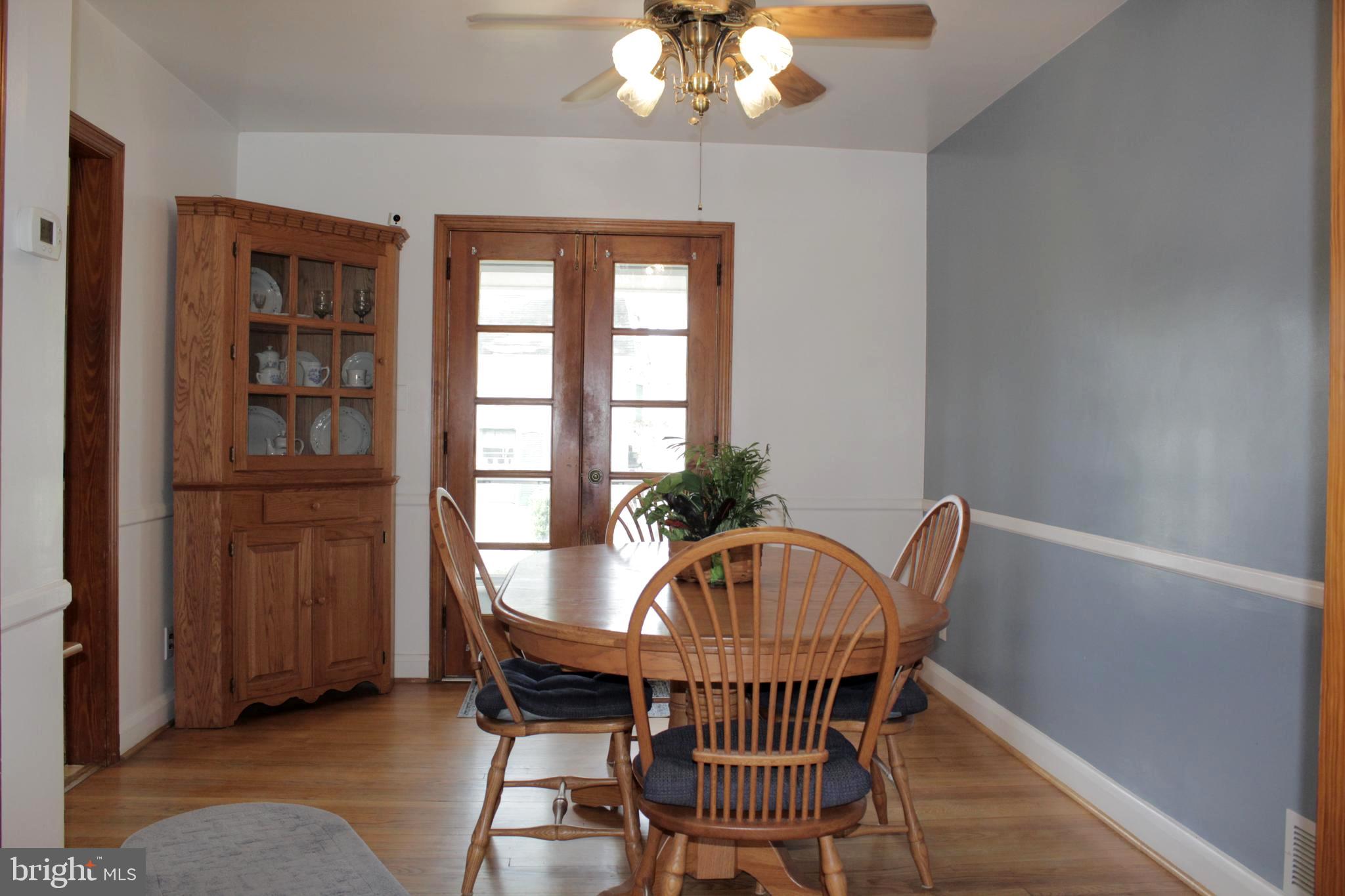 112 17th Avenue Baltimore, MD 21225 - Photo 11 of 40 a view of a dining room with furniture window and wooden floor