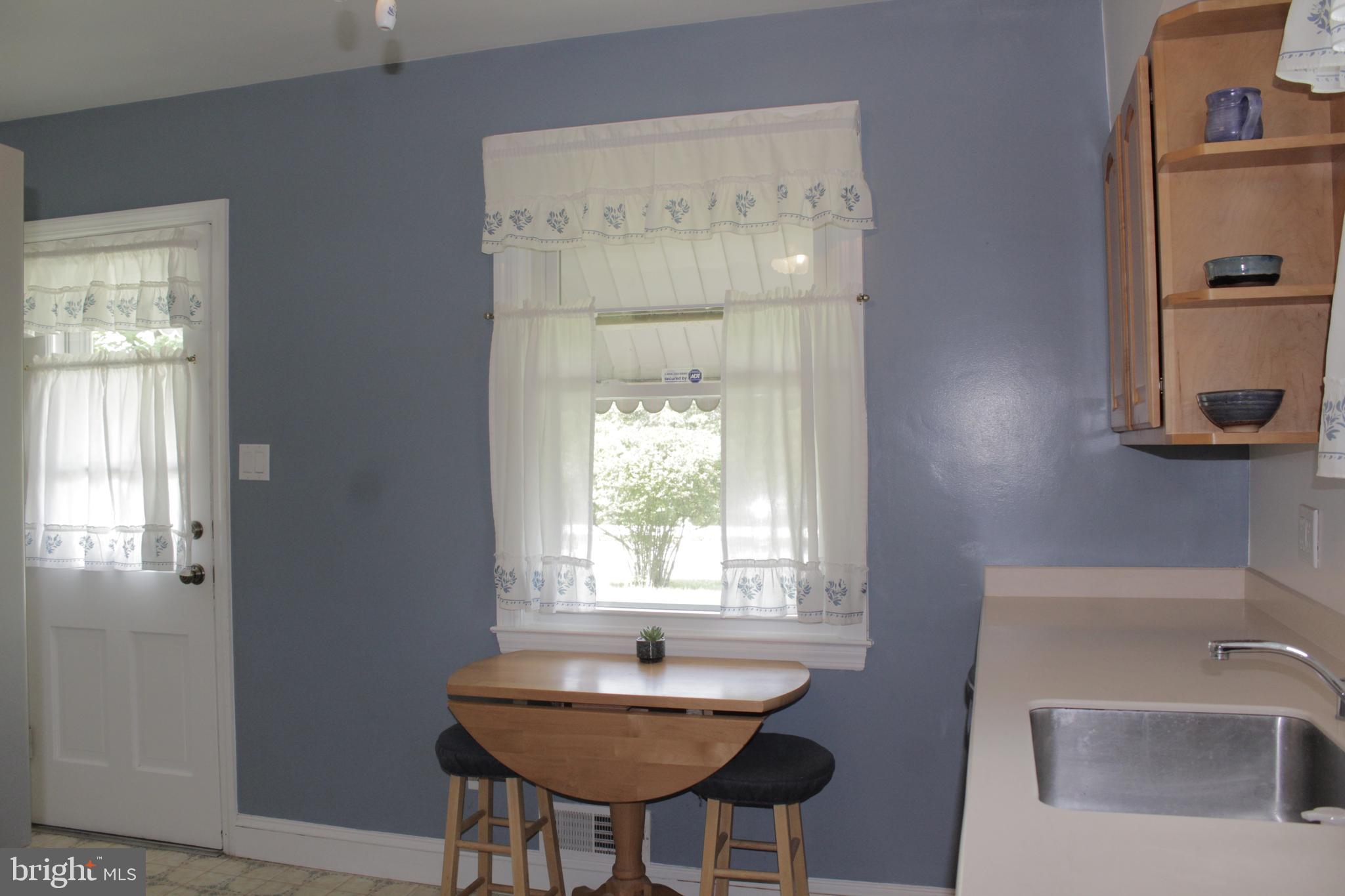 112 17th Avenue Baltimore, MD 21225 - Photo 15 of 40 a bathroom with a sink a bathtub and a window