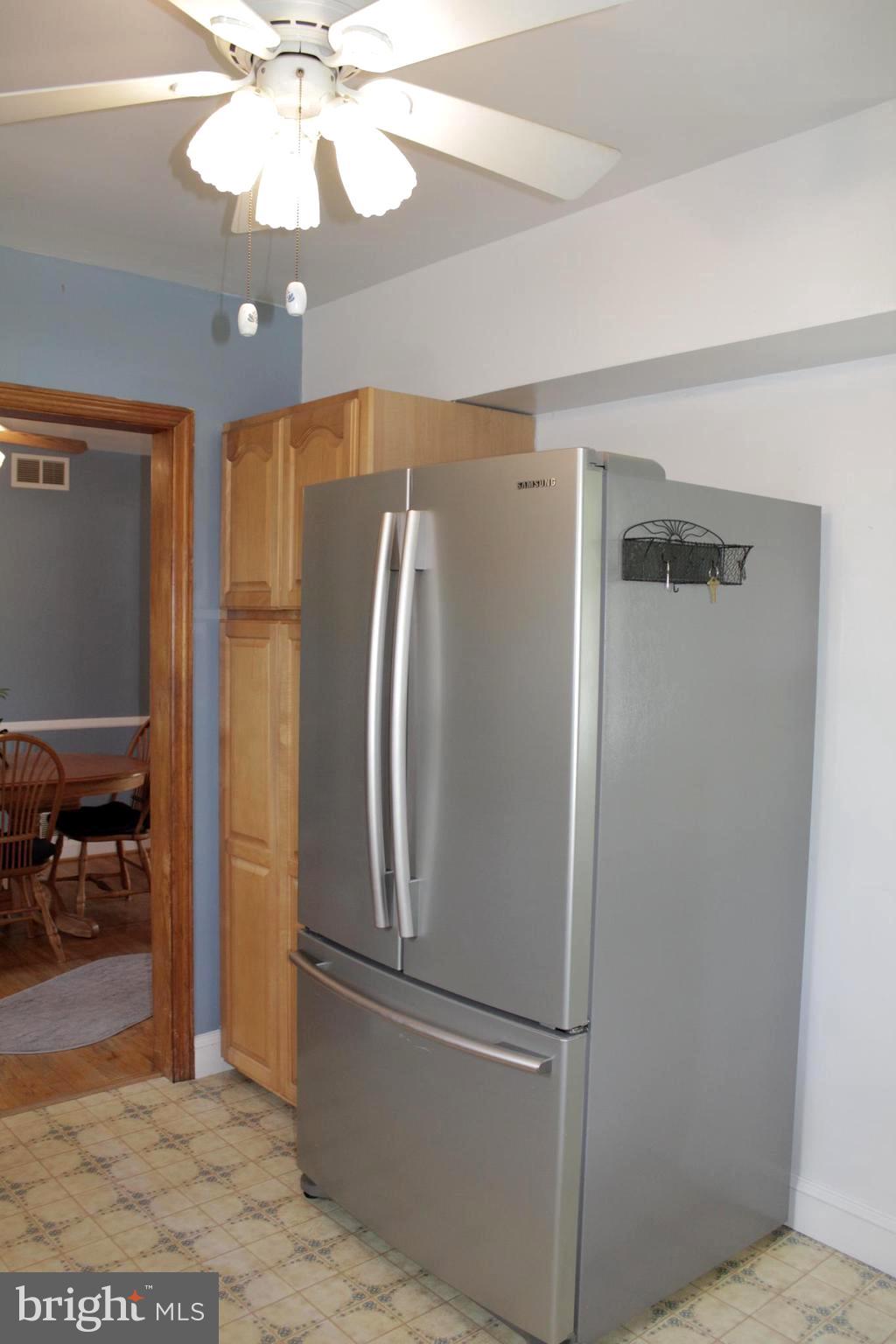 112 17th Avenue Baltimore, MD 21225 - Photo 16 of 40 a view of a livingroom with a chandelier fan and windows