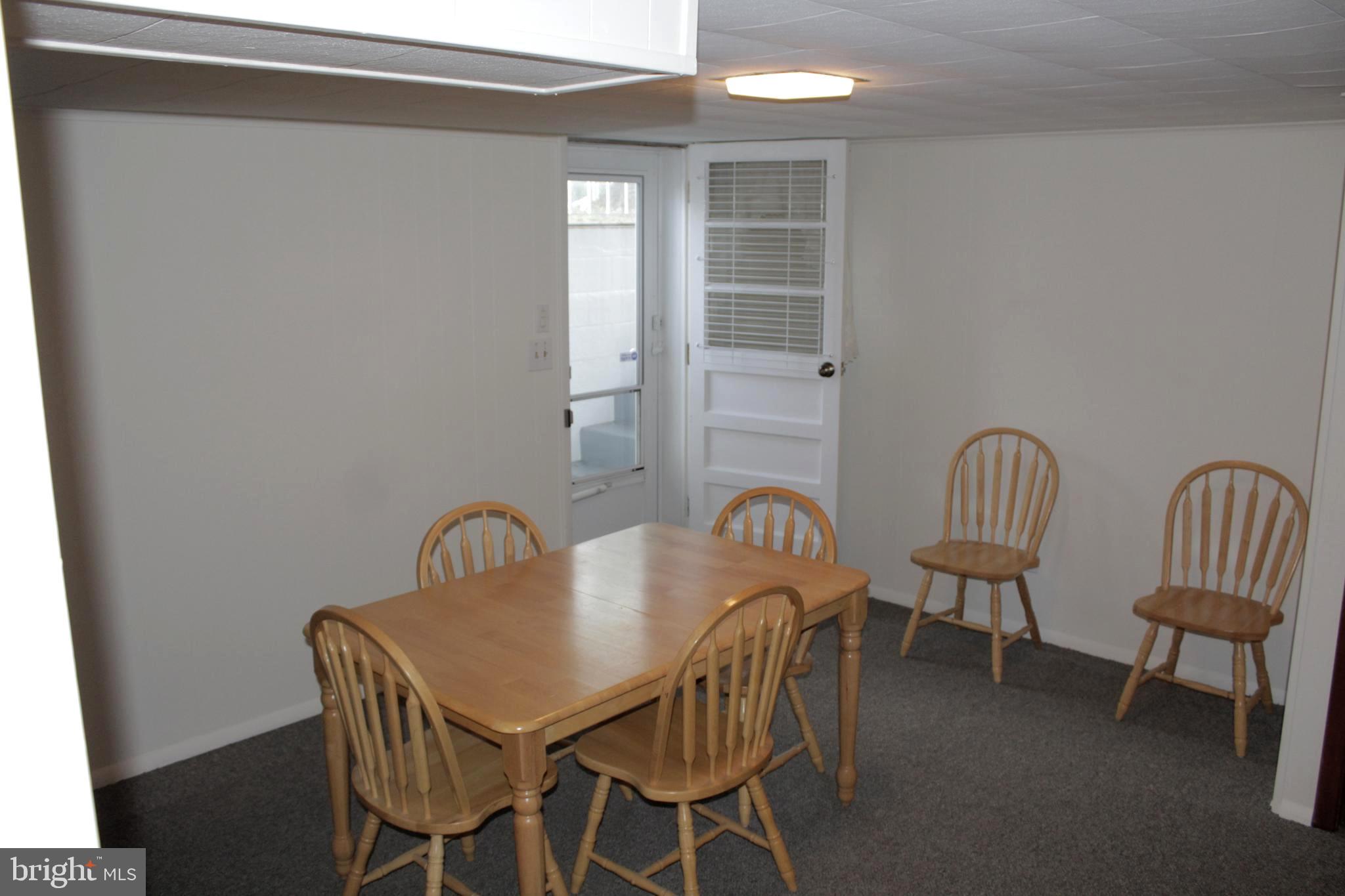 112 17th Avenue Baltimore, MD 21225 - Photo 25 of 40 a view of a dining room with furniture and window