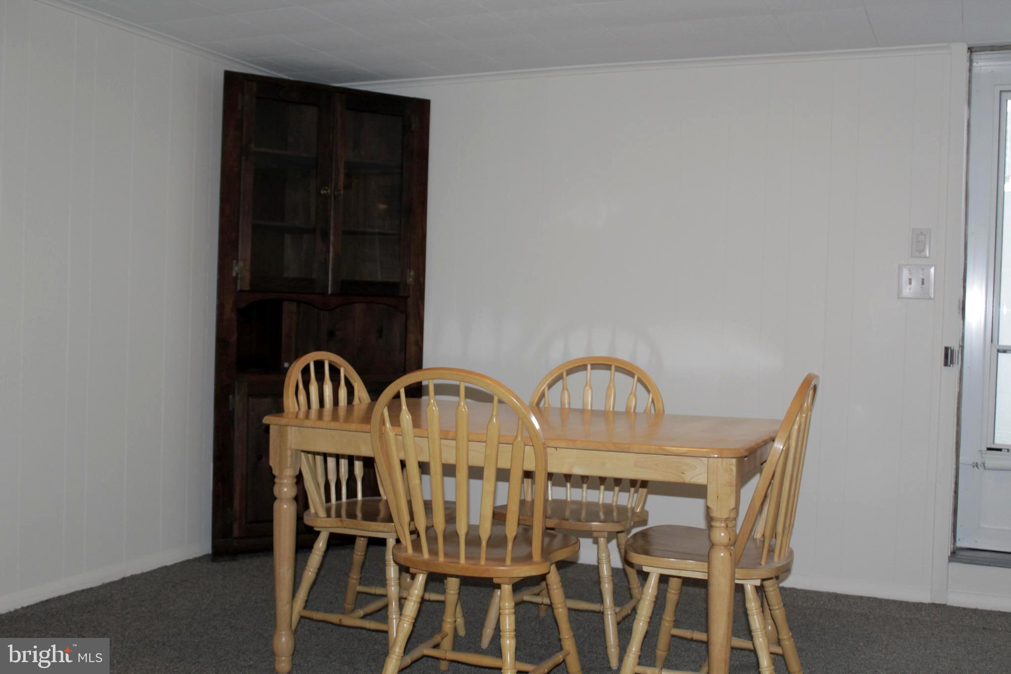 112 17th Avenue Baltimore, MD 21225 - Photo 26 of 40 a view of a dining room with furniture