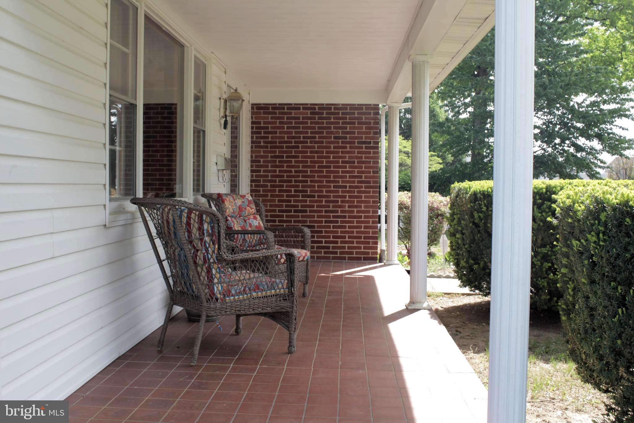 112 17th Avenue Baltimore, MD 21225 - Photo 3 of 40 a view of two chairs in the balcony