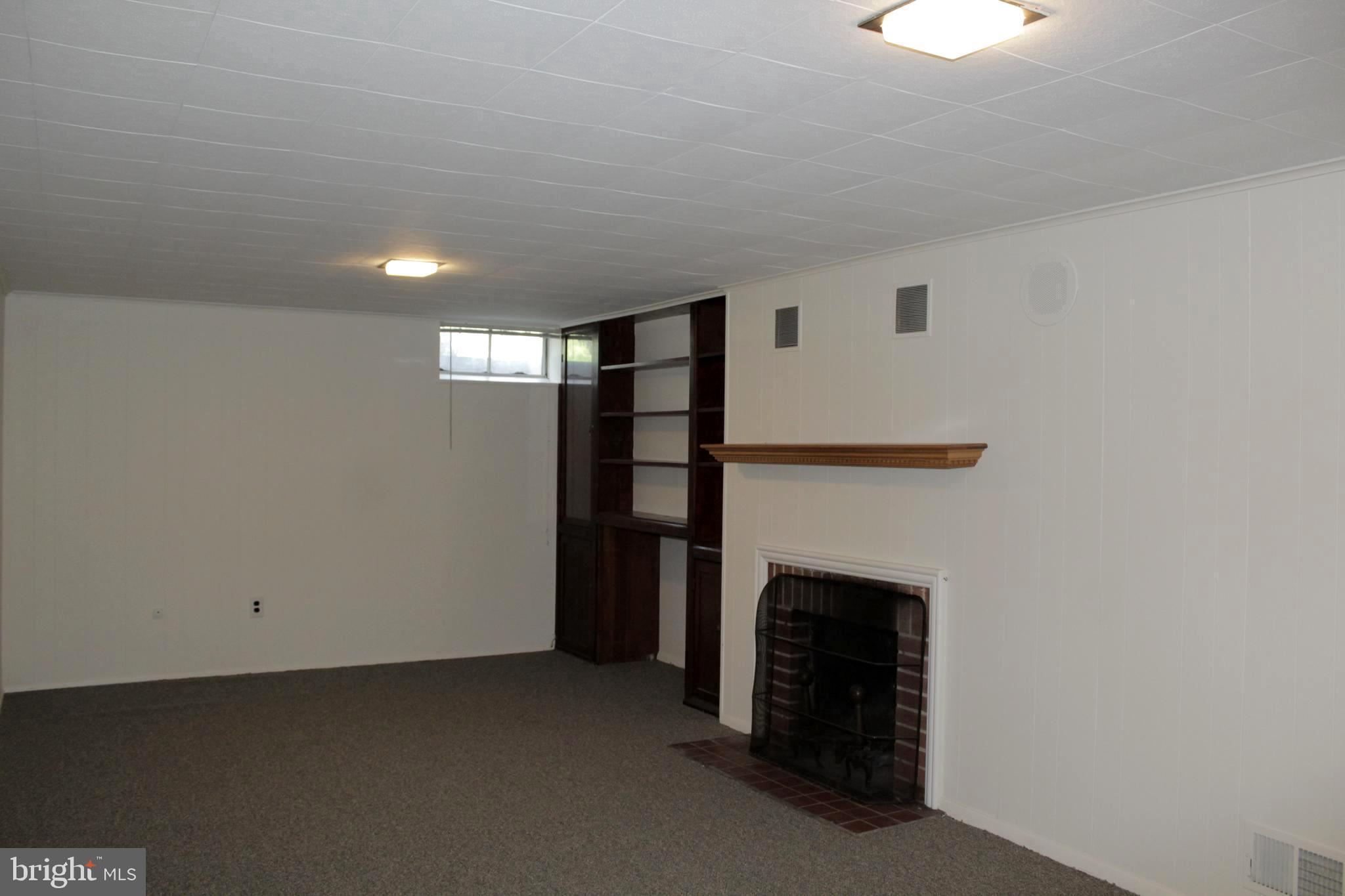 112 17th Avenue Baltimore, MD 21225 - Photo 32 of 40 a view of empty room with a fireplace
