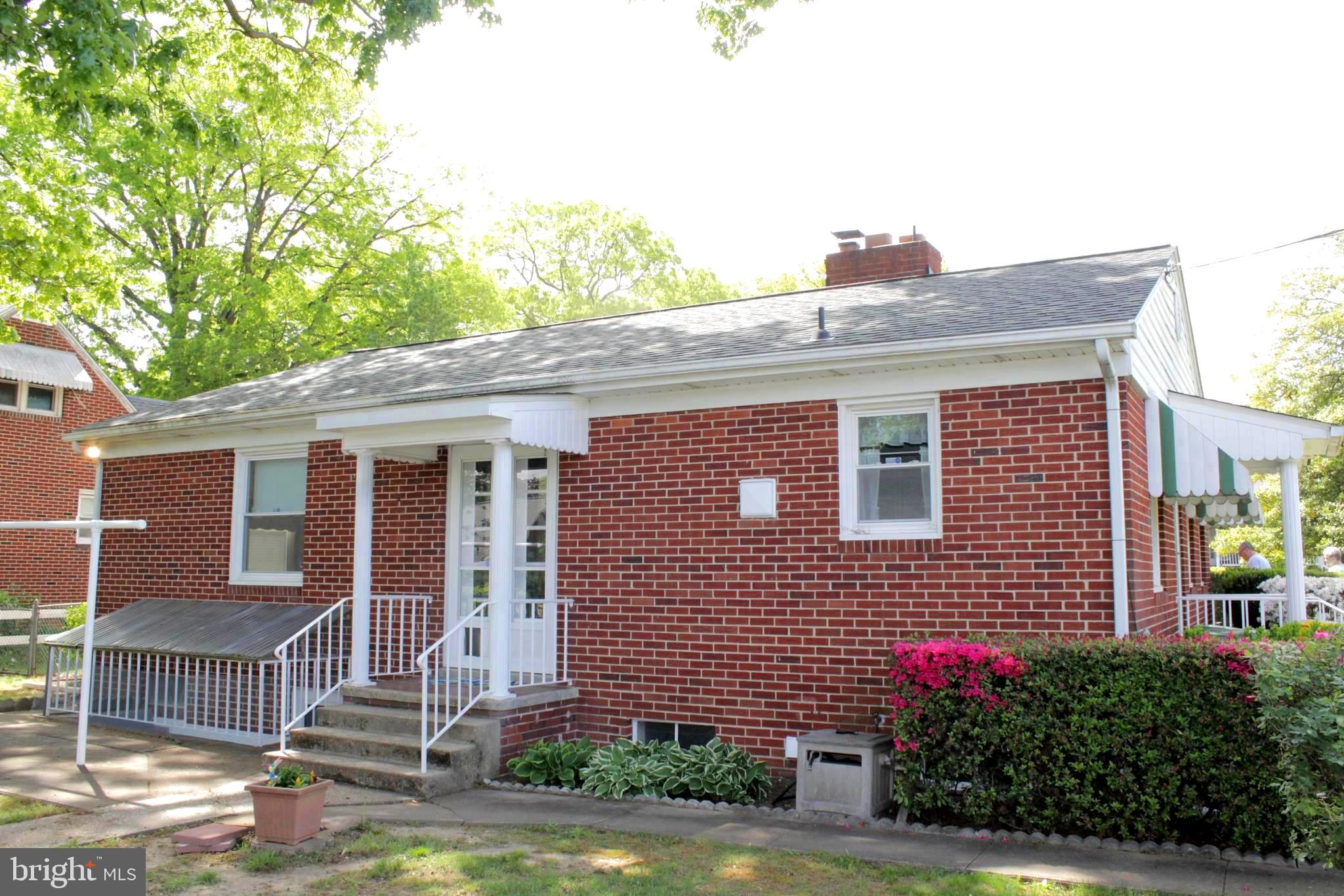 112 17th Avenue Baltimore, MD 21225 - Photo 33 of 40 a front view of a house with a yard