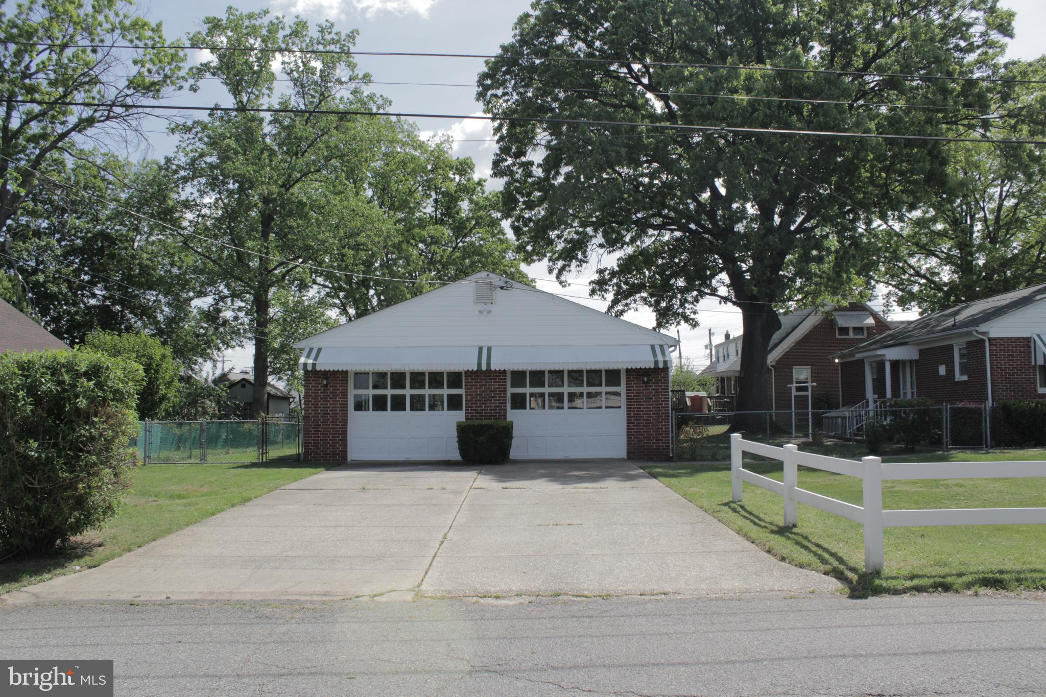 112 17th Avenue Baltimore, MD 21225 - Photo 37 of 40 a view of house with outdoor space and trees