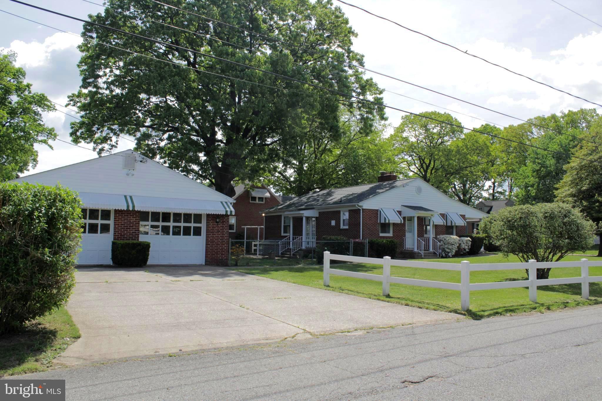 112 17th Avenue Baltimore, MD 21225 - Photo 38 of 40 a front view of a house with a yard