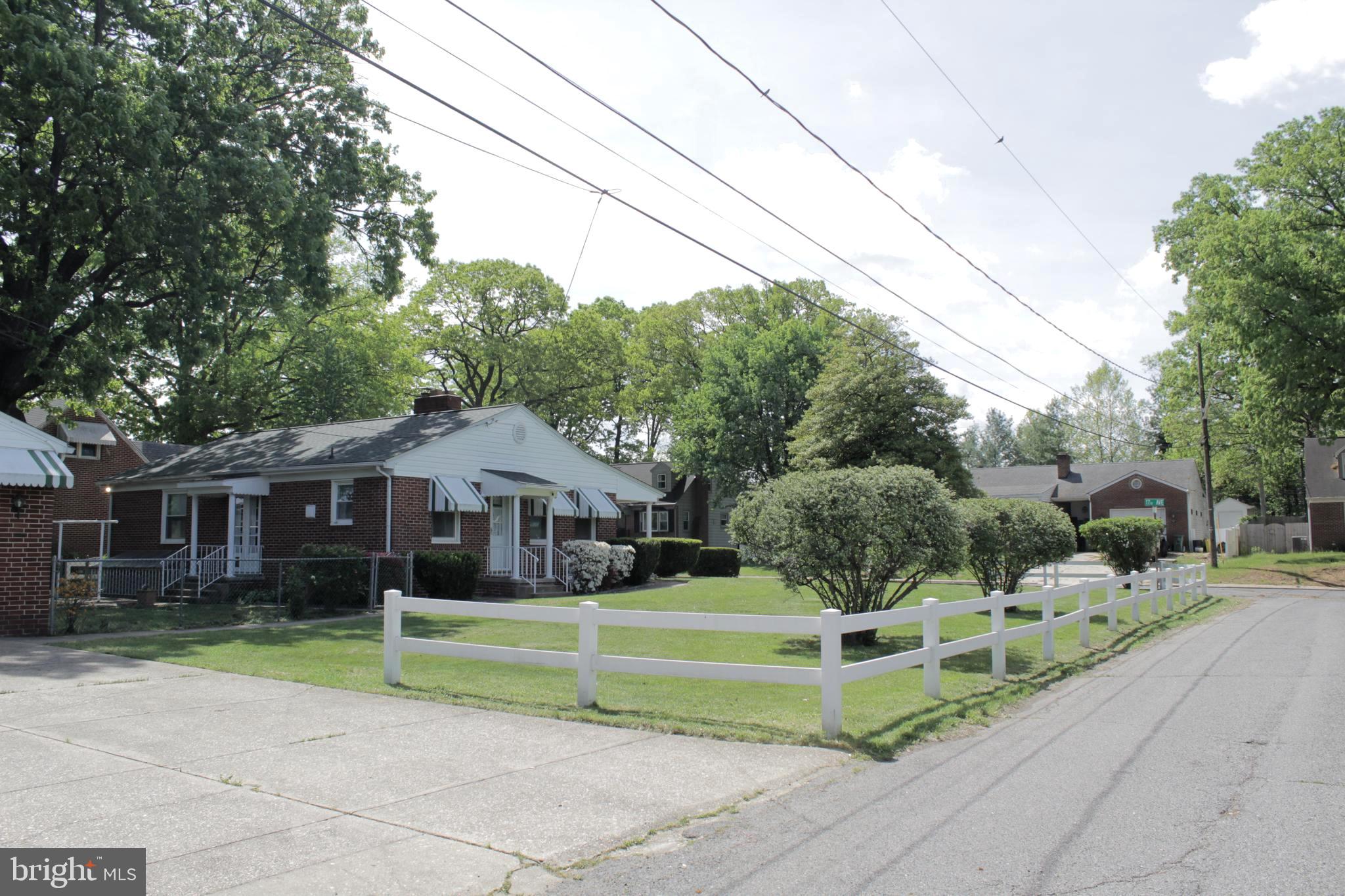 112 17th Avenue Baltimore, MD 21225 - Photo 39 of 40 a front view of a house with a yard