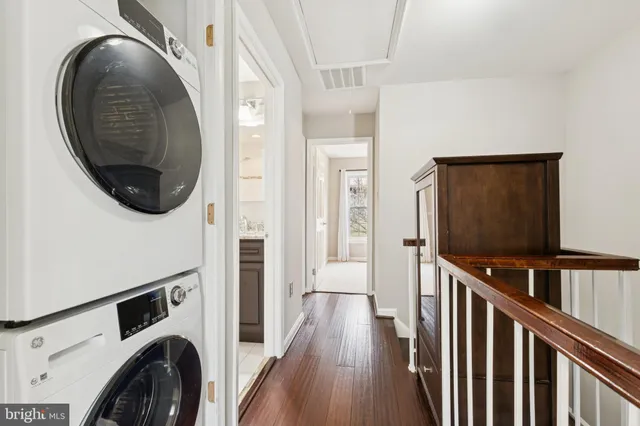 a view of a hallway with washer and dryer