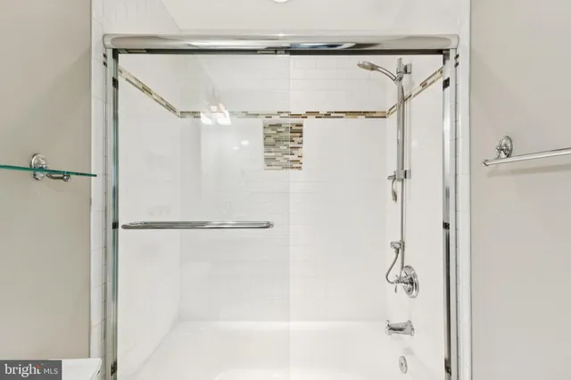 a bathroom with a shower and a shower