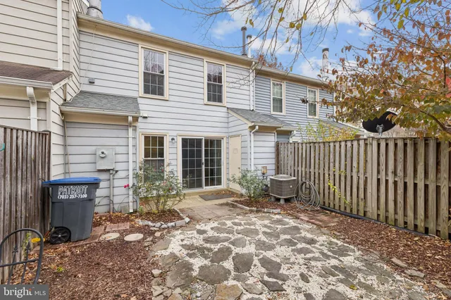 a side view of a house with a patio