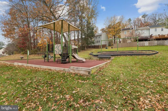 a view of a park with swings and slides