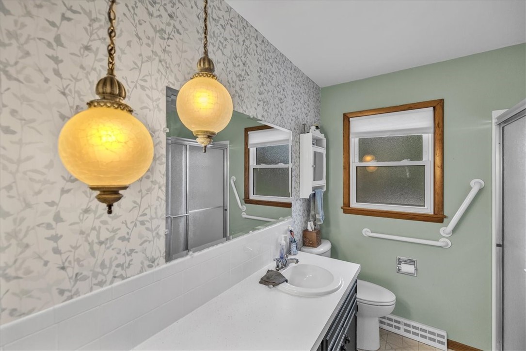 2220 West Ravina Park Road Decatur, IL 62526 - Photo 24 of 36 a bathroom with a mirror and a sink