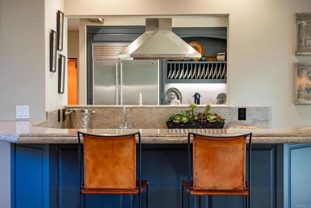 14479 Emerald Lane Rancho Santa Fe, CA 92067 - Photo 13 of 52 a kitchen with a sink and a refrigerator