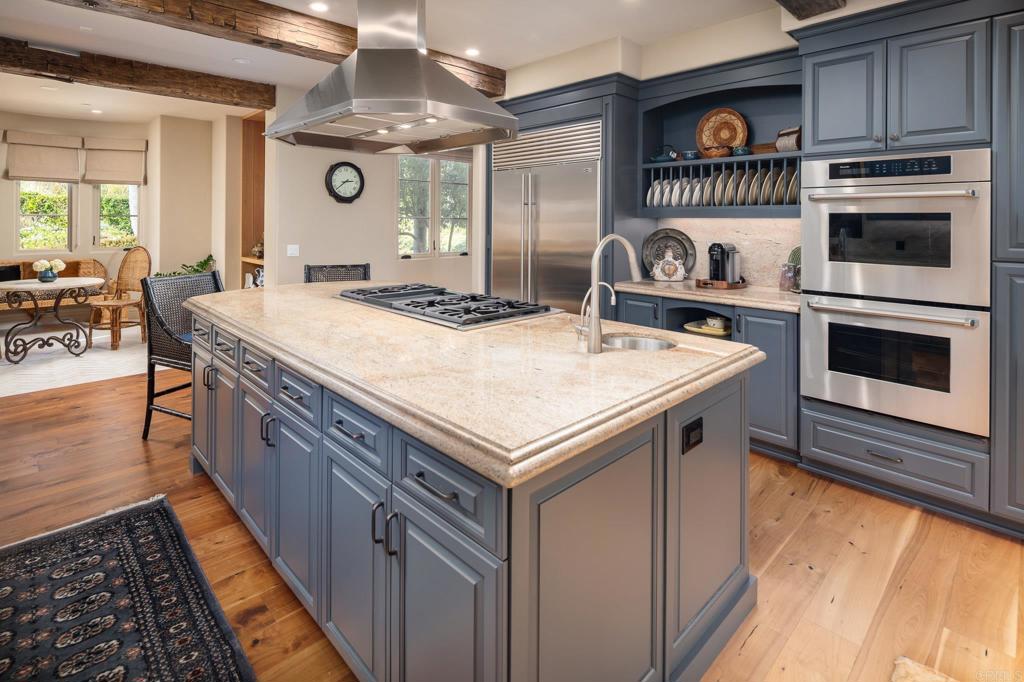 14479 Emerald Lane Rancho Santa Fe, CA 92067 - Photo 16 of 52 a kitchen with a stove and a refrigerator