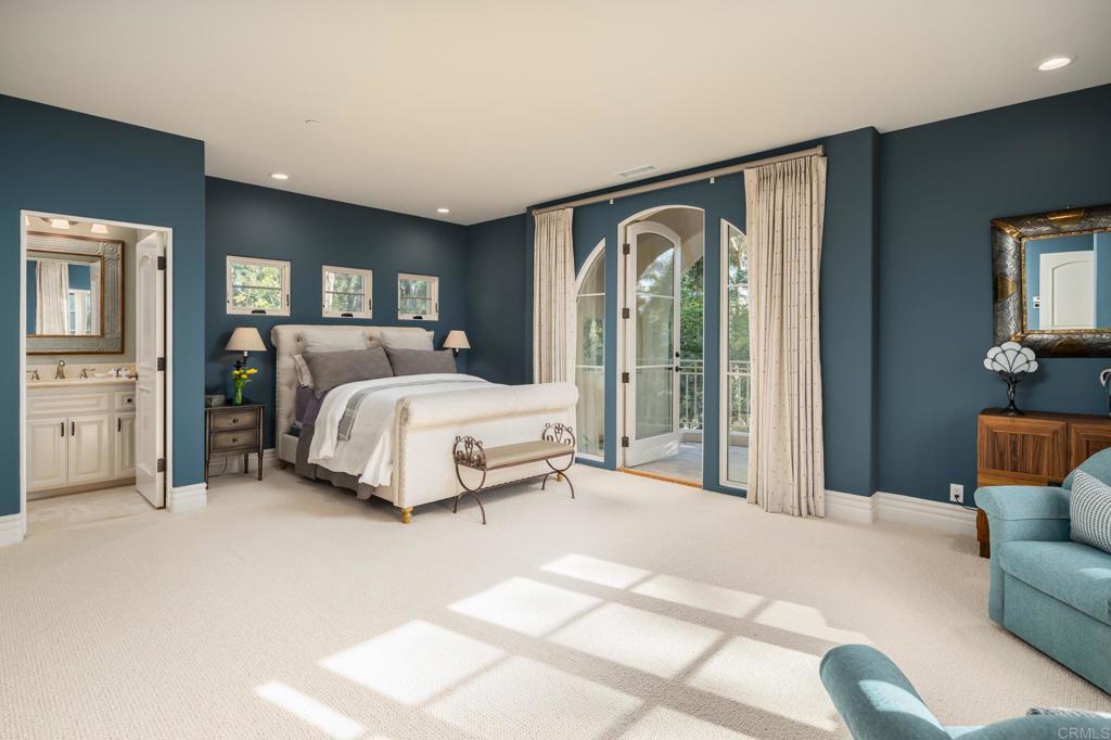 14479 Emerald Lane Rancho Santa Fe, CA 92067 - Photo 27 of 52 a bedroom with a bed lamp and a large window