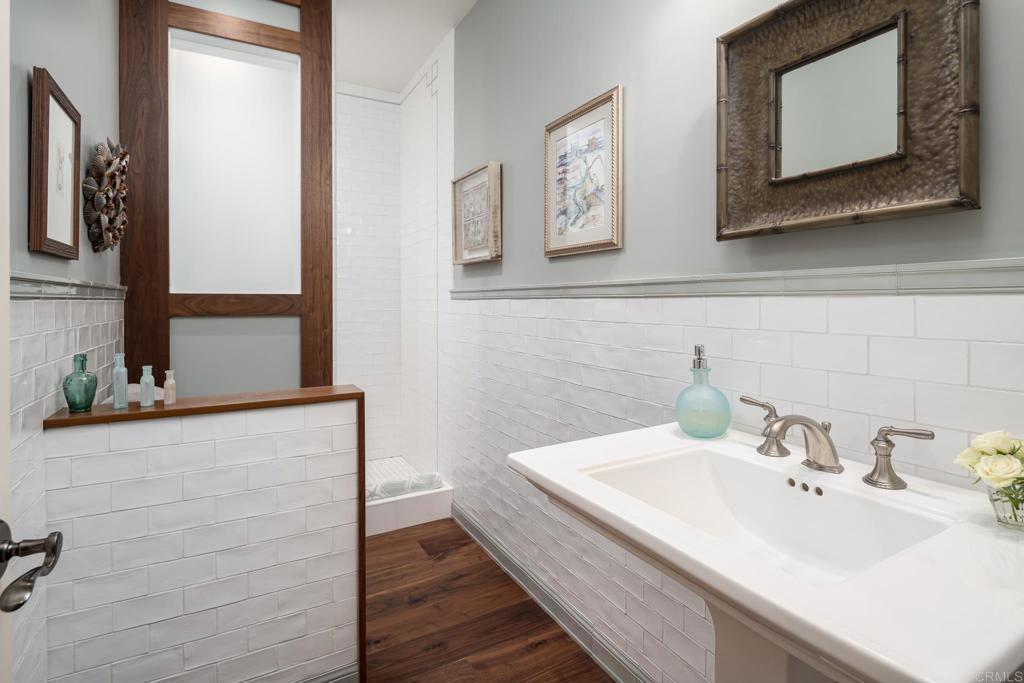 14479 Emerald Lane Rancho Santa Fe, CA 92067 - Photo 30 of 52 a bathroom with a sink and a mirror