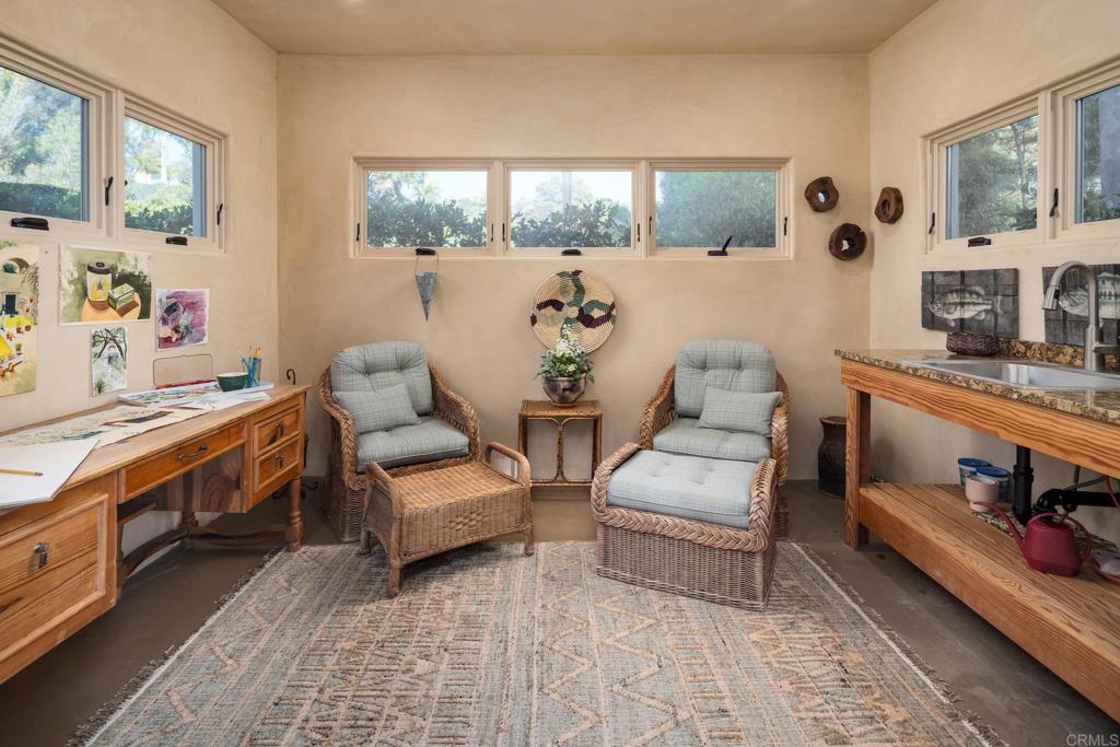 14479 Emerald Lane Rancho Santa Fe, CA 92067 - Photo 36 of 52 a living room with furniture and a flat screen tv