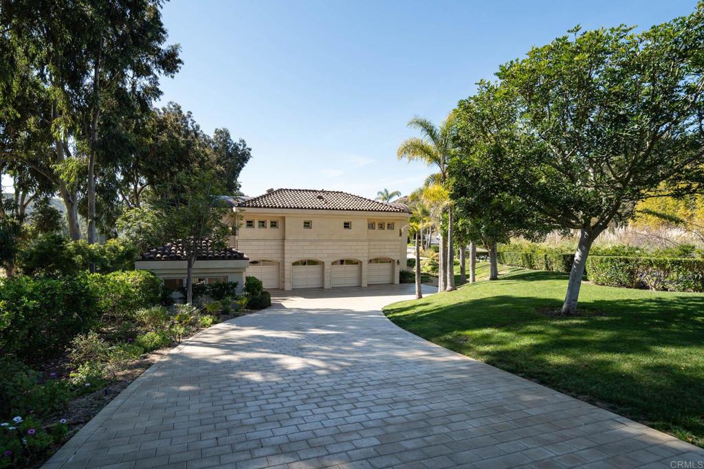 14479 Emerald Lane Rancho Santa Fe, CA 92067 - Photo 42 of 52 a front view of a house with a yard