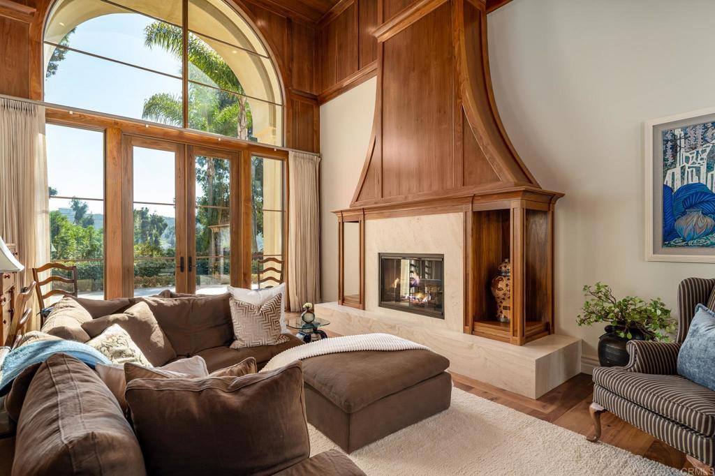 14479 Emerald Lane Rancho Santa Fe, CA 92067 - Photo 6 of 52 a living room with furniture fireplace and a large window