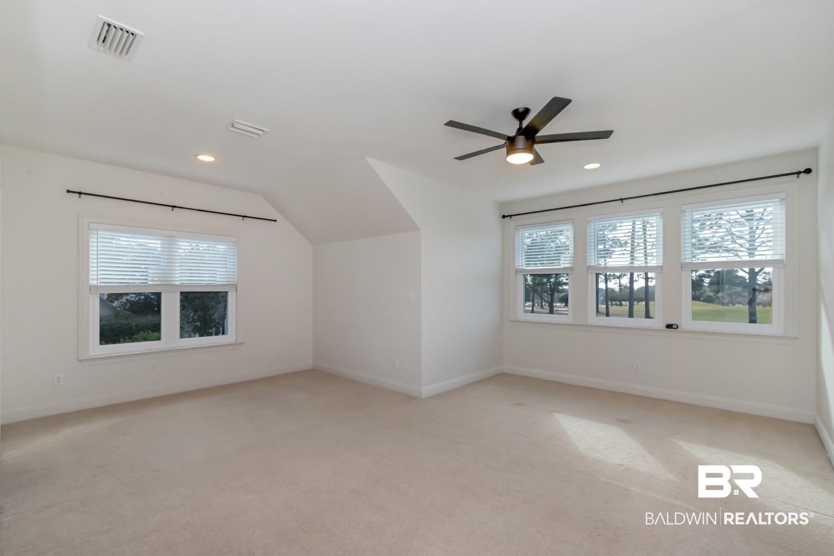 30585 Pine Court Daphne, AL 36527 - Photo 16 of 49 Bonus room with light carpet, lofted ceiling, and ceiling fan