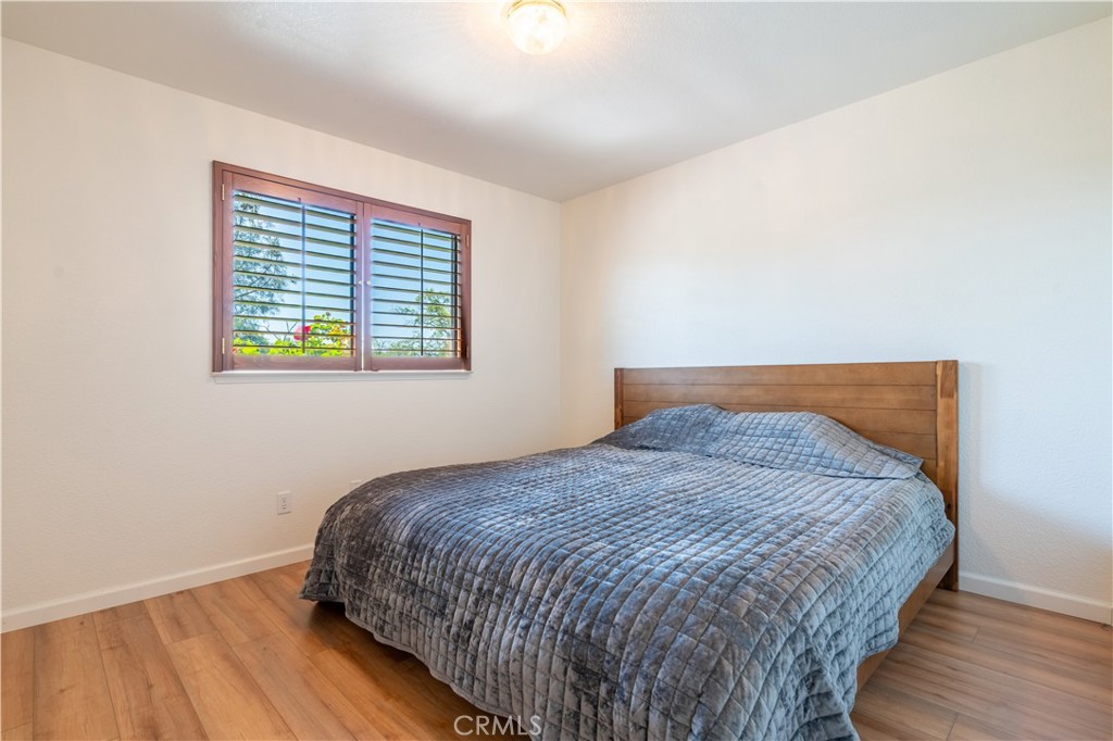 3729 Ben Hur Road Mariposa, CA 95338 - Photo 46 of 57 a bed sitting in a bedroom next to a window