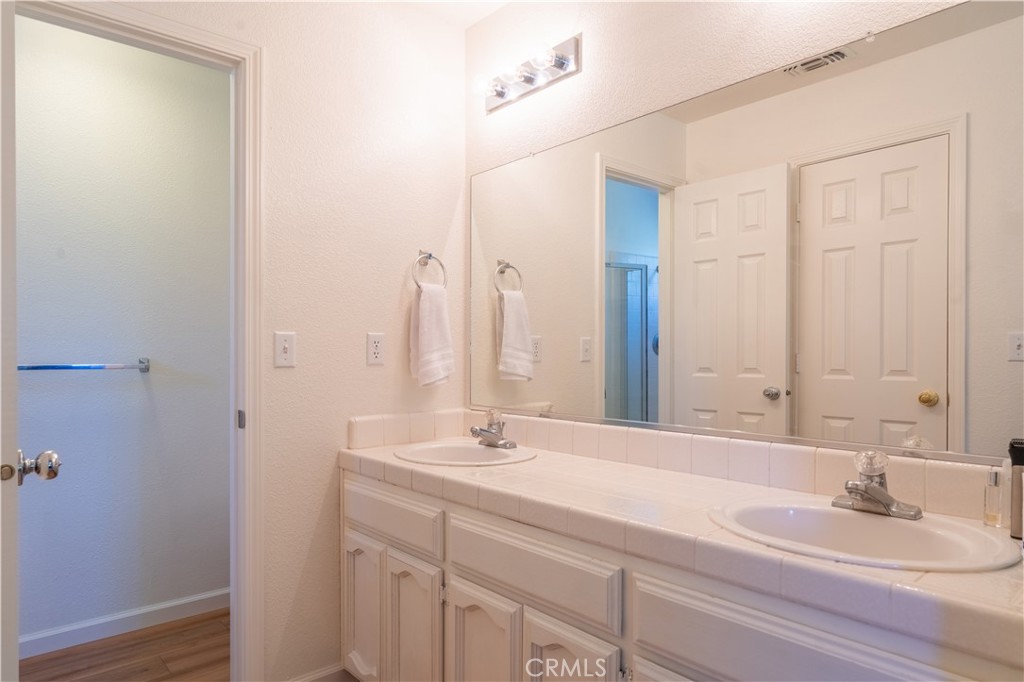 3729 Ben Hur Road Mariposa, CA 95338 - Photo 48 of 57 a bathroom with a double vanity sink and a mirror