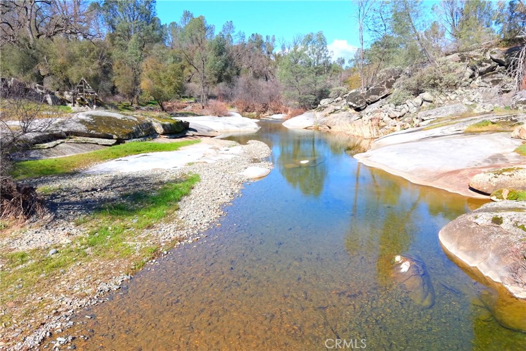 3729 Ben Hur Road Mariposa, CA 95338 - Photo 7 of 57 a view of a lake with houses