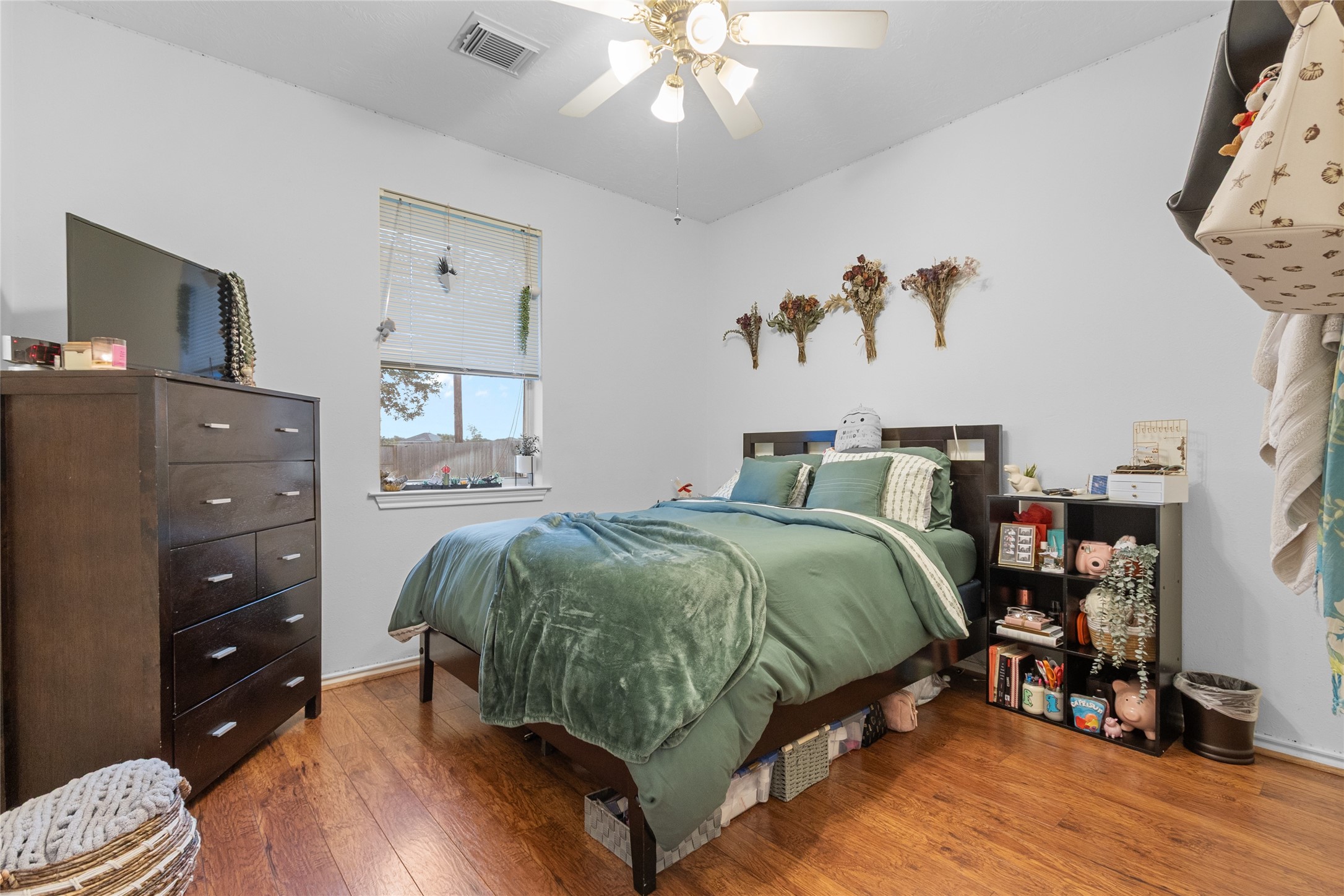 21014 Jessica Rose Lane Spring, TX 77379 - Photo 15 of 30 a bedroom with a bed and wooden floor