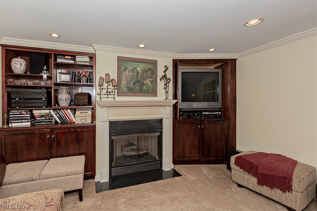2415 Fenwick Road University Heights, OH 44118 - Photo 27 of 35 Terrific built-ins and gas fireplace (with remote) in the lower level.