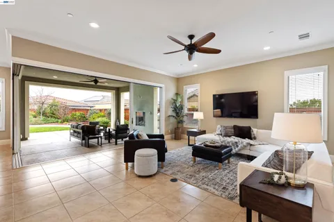 a kitchen with kitchen island a sink dining table and chairs