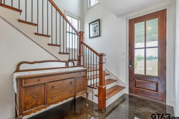 a view of entryway with a staircase