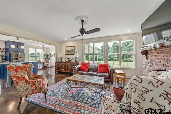 a living room with furniture and a large window