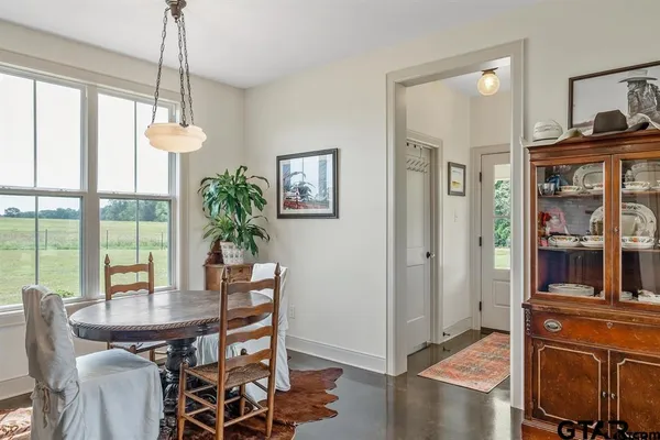 a dining room with furniture window wooden floor