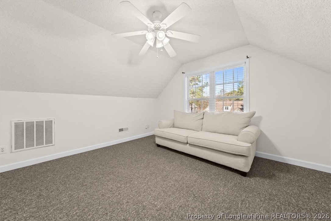 60 Spring Lake Drive Pinehurst, NC 28374 - Photo 29 of 42 a living room with furniture and white walls