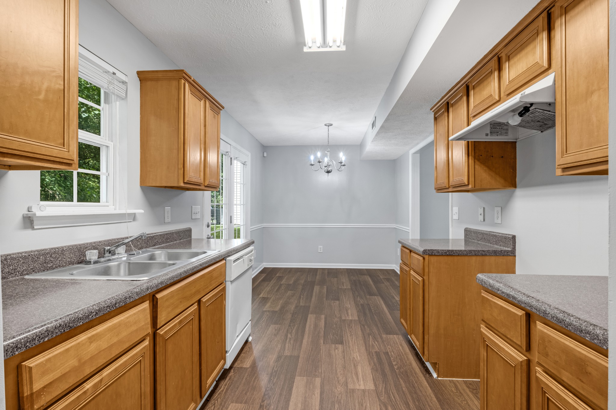 809 Dover Glen Drive Antioch, TN 37013 - Photo 12 of 23 a kitchen with a sink a microwave and cabinets